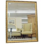 Large rectangular gilt framed wall mirror inset with a bevelled glass plate, 40" x 52"