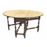 18th century oak oval gateleg table, the top supported upon baluster turned columns and stretchers