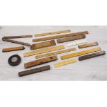 Assorted vintage folding wooden rulers; also three spirit levels including by Rabone, and an L.S