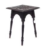 Small carved oak Moorish type side table, the square top with star decoration on turned legs, top