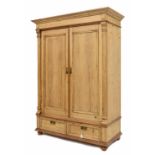 Provincial stripped pine double robe, with panelled doors over two short drawers upon bun feet, 56"
