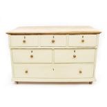 Large painted pine chest of drawers, the scrubbed top over three drawers, two drawers and a single