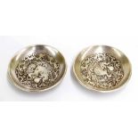 Pair of Chinese silvered bronze dishes, each cast with dragon decoration, further cloud decoration