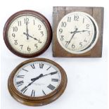Three electric slave dial clocks within wooden surrounds, two by the International Time Recording