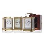 Carriage clock timepiece within a corniche brass case, 5.5" high (key); also with an outer Morocco