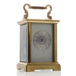 French carriage clock striking on a gong, the 1.75" chapter ring with Arabic numerals enclosing a