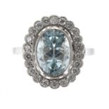 Large platinum aquamarine and diamond oval dress cluster ring, the aquamarine 2.90ct,in a surround