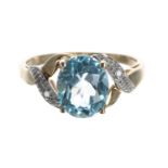 Blue topaz and diamond 9ct cross-over dress ring, width 10mm, 2.8gm, ring size P