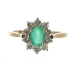 Large 9ct emerald and diamond oval cluster ring, the emerald 1.00ct approx, in a surround of ten