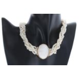 Attractive pearl multi-strand necklace with an oval gold mounted coral cameo portrait clasp set with
