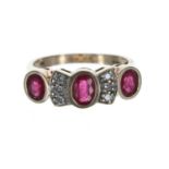 Ruby and diamond 9ct ring, set with three oval rubies, estimated 1.20ct in total, width 8mm, 4.