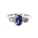 Platinum tanzanite and diamond three stone ring, the oval tanzanite of good colour 1.30ct approx,