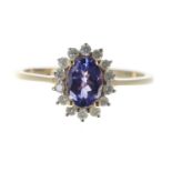 Tanzanite and diamond 9ct oval cluster ring, the tanzanite 0.75ct approx, table 11mm x 9mm, 1.9gm,