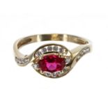 14k yellow gold ruby and diamond oval cluster ring, the ruby 0.60ct approx, 3.7gm, width 10mm,