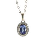 9ct tanzanite and diamond oval pendant on a yellow gold slender necklace, the tanzanite 1.00ct
