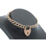 9ct graduated curb link bracelet with a heart shaped clasp, each link individually stamped, 22.