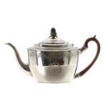 George III silver teapot, with hardwood handle and acorn finial, the body with engraved foliate