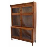 Early 20th century oak glazed stepped bookcase, with two small rectangular glazed doors over two
