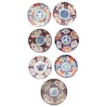 Collection of seven Japanese Imari plates, six with shaped rim and decorated in a typical palette