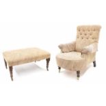 Victorian style button-back upholstered armchair, with a pale paisley style design upholstery upon