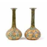 Matched pair of Doulton & Slaters patent stoneware slim neck bottles vases, the bodies with gilt