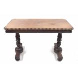 19th century rosewood library table, the rectangular top with a gadrooned border upon turned and
