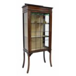 Edwardian mahogany inlaid display cabinet, with a single leaded stained glass door enclosing fixed