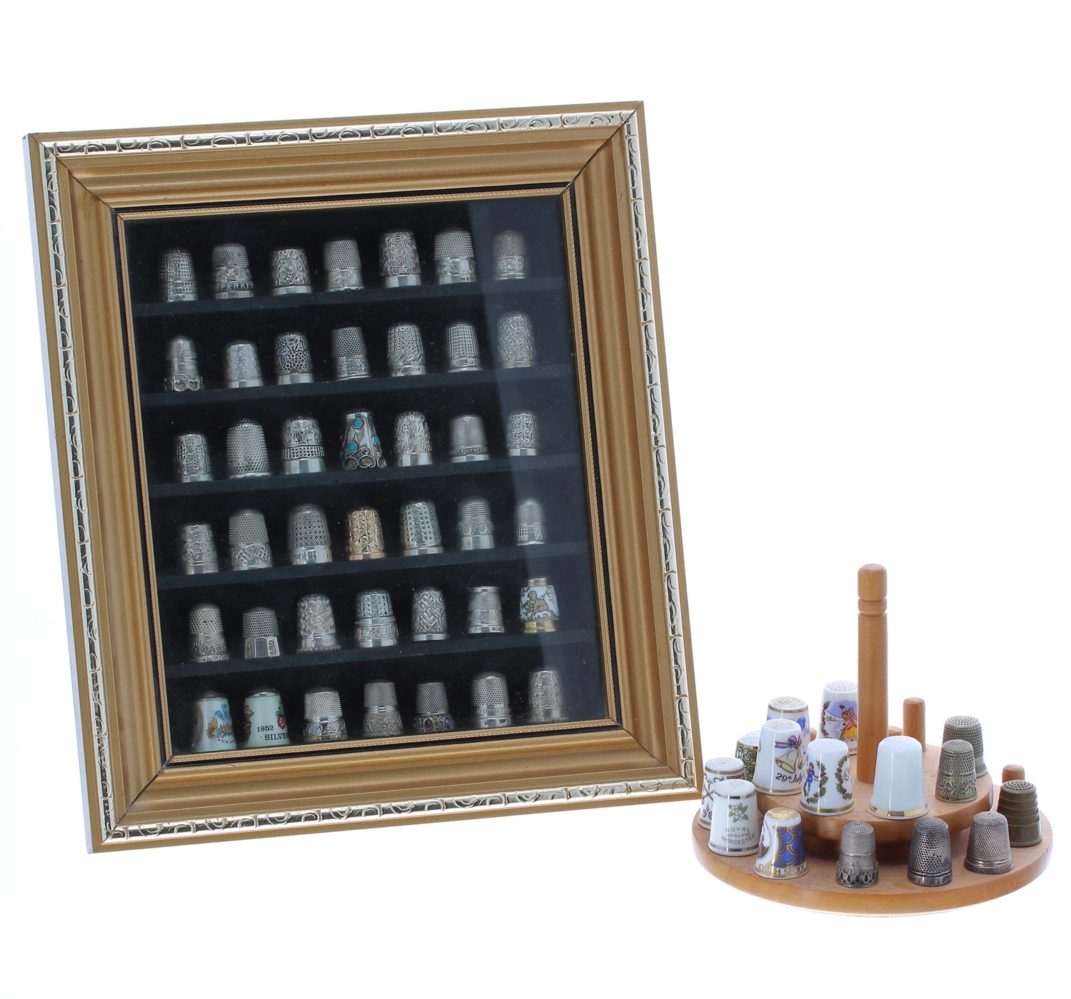 Private collection of silver thimbles in a display case, to include forty-one silver thimbles and