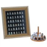 Private collection of silver thimbles in a display case, to include forty-one silver thimbles and