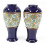 Pair of Doulton & Slaters patent stoneware baluster vases, decorated with bands of repeated motif on