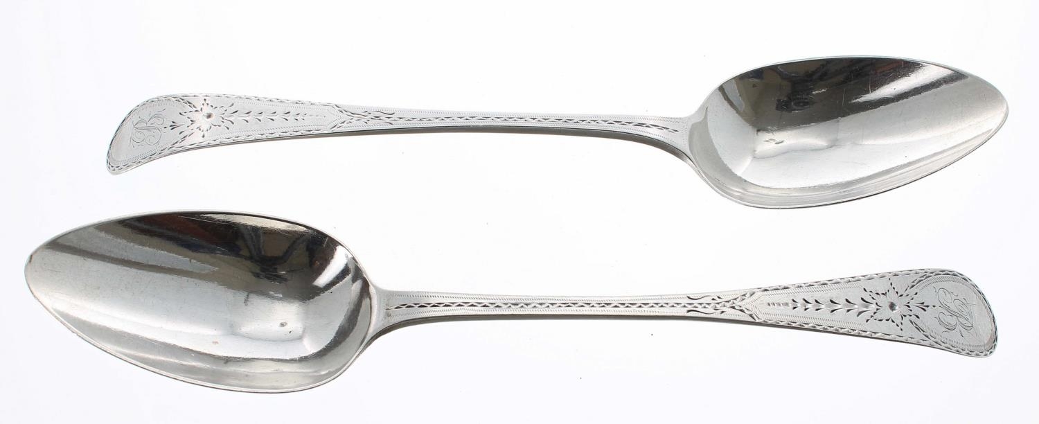Pair of George III silver table spoons, with bright cut handles initialled B, further marked H*D