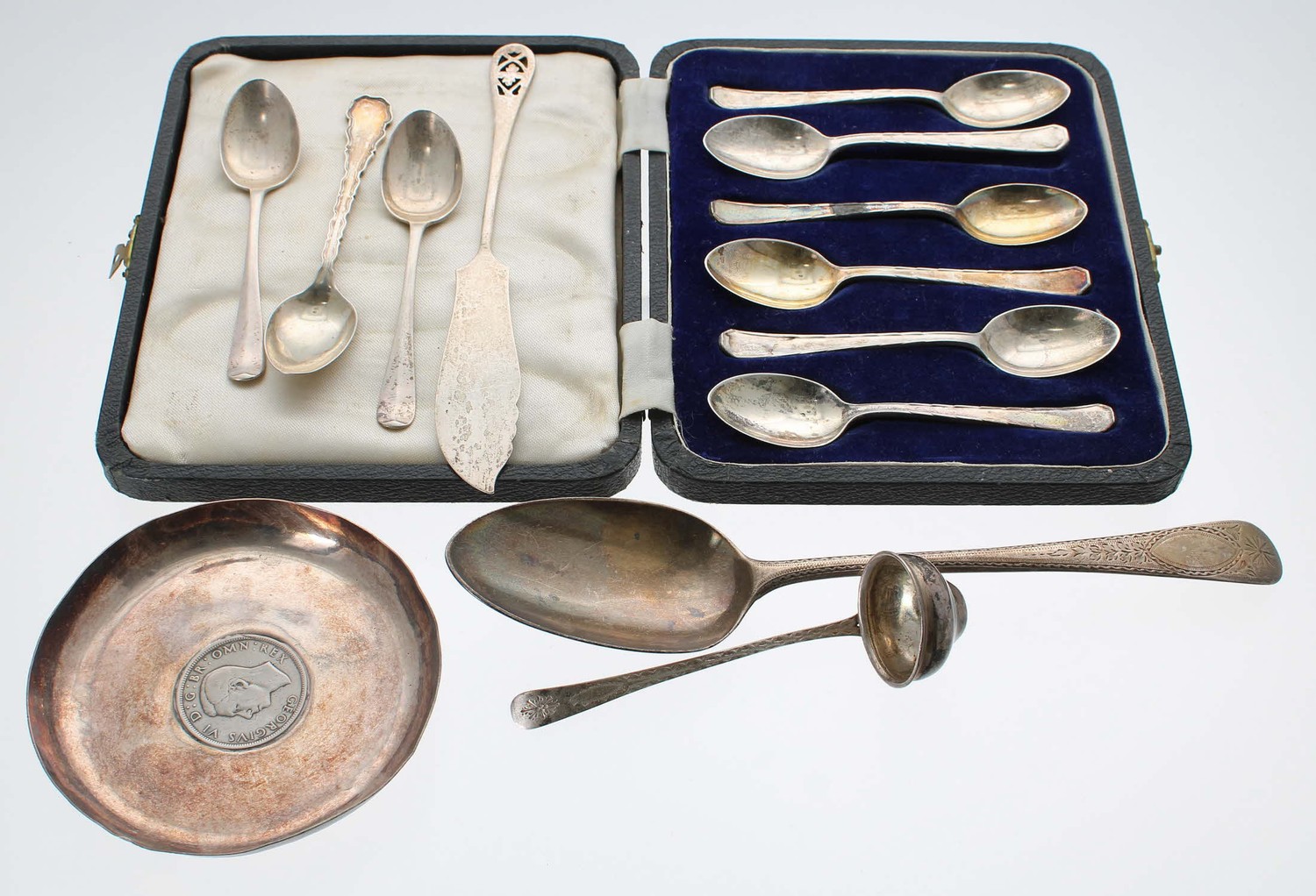 Assorted silver flatware including a George III silver serving spoon, the handle with engraved