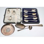 Assorted silver flatware including a George III silver serving spoon, the handle with engraved