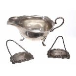George V silver cream jug, with shaped cut rim and raised on three feet, maker Synyer & Beddoes,