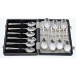 Cased set of six Joseph Elliot & Sons silver coffee spoons, each with foliate decorated handles,