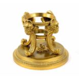 French gilt metal ink/desk stand base, cast with four masked scrolling feet on a circular base,