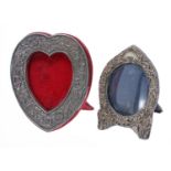 Two repousse photo frames, one silver Birmingham 1903, 5" high, 4" wide; the other heart shaped