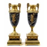 Pair of decorative French gilt metal and veined green marble urns, each with an applied dancing