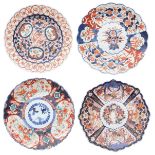 Four 19th Century Japanese Imari chargers, all decorated in a typical palette, one octagonal, 12"