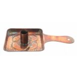 Newlyn copper chamber stick, repousse decorated with fish on a square base, stamped Newlyn, 8.75"