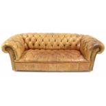 Good tan leather and studded upholstered button-back Chesterfield settee, 84" wide approx, 38" deep,