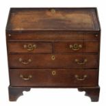 Early 18th century oak bureau, the crossbanded fall front enclosing a fitted interior with a sliding