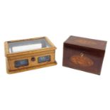 Georgian mahogany tea caddy of rectangular form, with inlaid conch shell paterae to the cover and