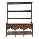 18th century oak small dresser, the Delft rack with two shelves over the base fitted with three long