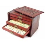 Wooden cased mahjong games set, applied with brass corner mounts, the box 9.5" wide, 6.75" high