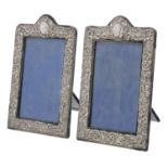 Pair of Henry Matthews silver repousse photograph frames, Birmingham 1910, 8" x 5" (2)