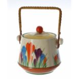 Clarice Cliff Bizarre 'Autumn Crocus' biscuit barrel and cover, with wicker swing handle, shape 336,