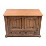 18th century style small oak coffer, the hinged top over a carved linen fold panelled front and