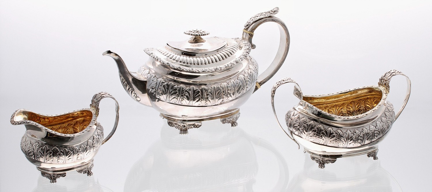 Good George IV boat shaped silver three piece tea set, comprising a teapot with floral capped handle