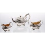 Good George IV boat shaped silver three piece tea set, comprising a teapot with floral capped handle